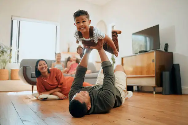 A family playing together at home after getting their finances back on track